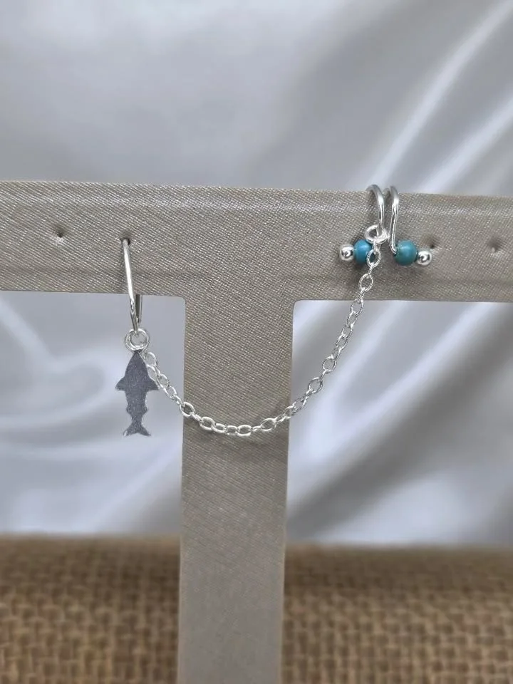 Piercing com corrente tubarão